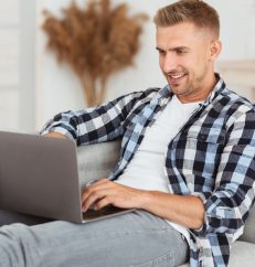 happy-freelancer-chatting-online-on-laptop-at-home-2021-08-29-09-39-30-utc.jpg