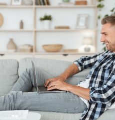 happy-man-chatting-online-on-laptop-with-friend-at-2021-08-28-21-58-32-utc.jpg