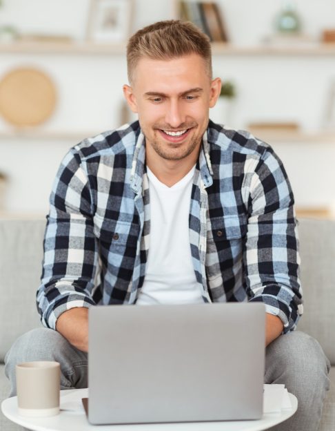 happy-man-chatting-online-on-laptop-with-friend-at-2021-08-29-10-33-36-utc.jpg